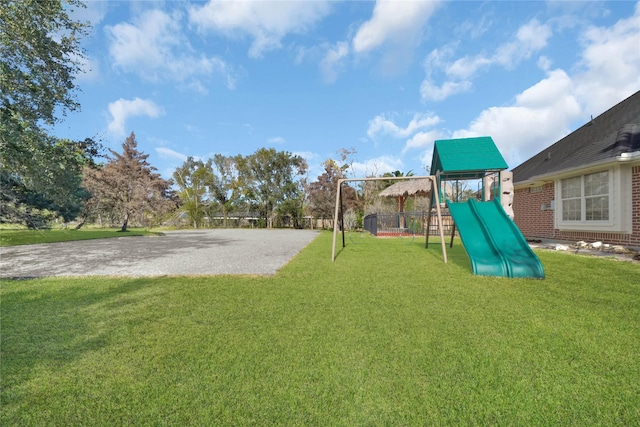 view of jungle gym featuring a yard