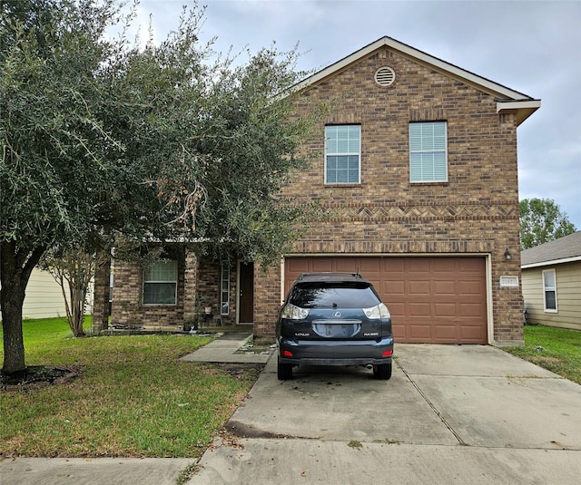 view of front property featuring a front yard and a garage