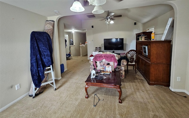 living room with ceiling fan, light colored carpet, and lofted ceiling