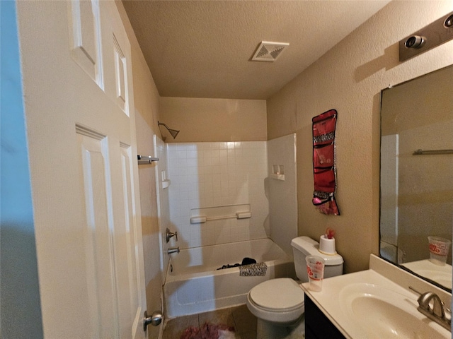 full bathroom with vanity,  shower combination, toilet, and a textured ceiling