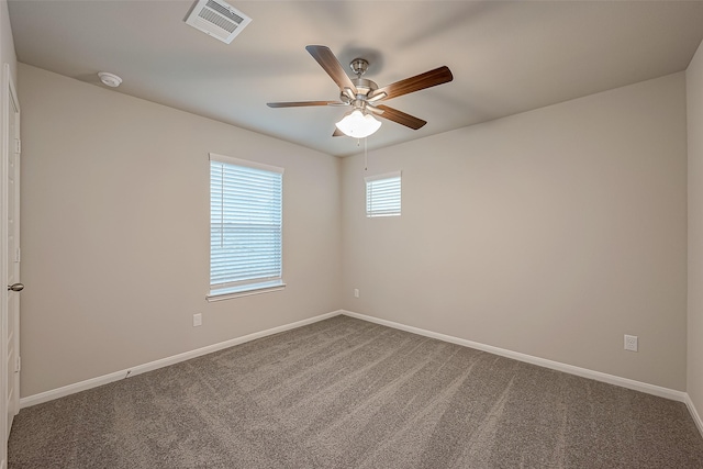 spare room featuring carpet flooring and ceiling fan