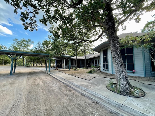 exterior space featuring a carport