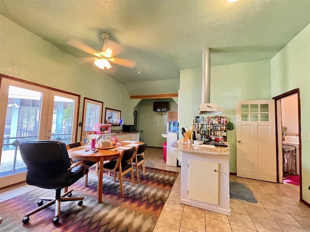 dining room with french doors, vaulted ceiling, ceiling fan, light tile patterned floors, and washer / dryer