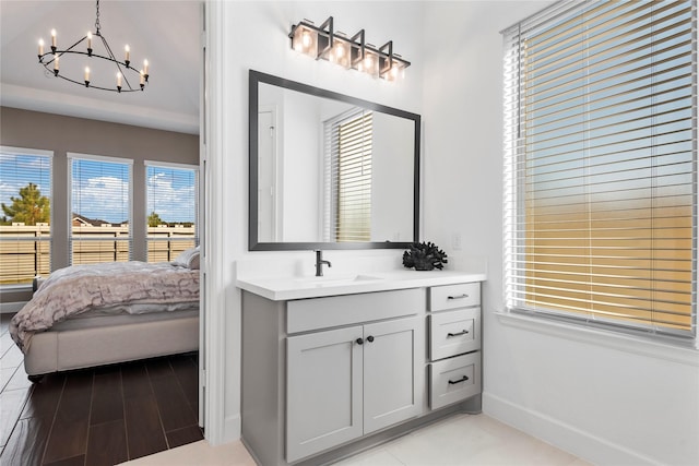 bathroom with vanity and a notable chandelier