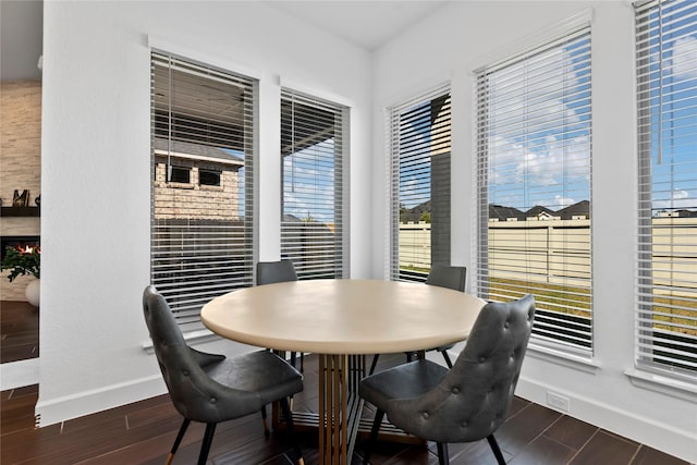 dining space featuring a fireplace