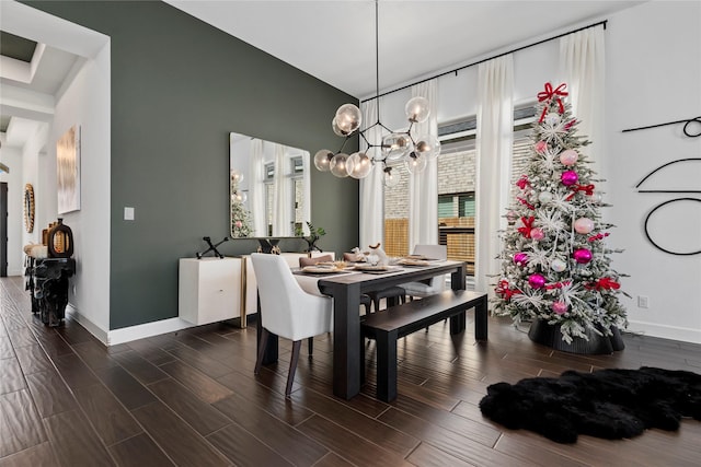 dining area with an inviting chandelier