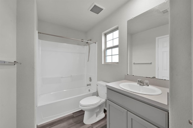 full bathroom with shower / bathing tub combination, vanity, toilet, and wood-type flooring