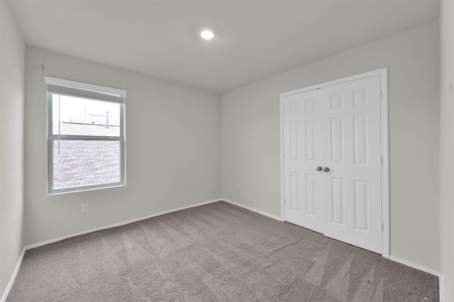 spare room featuring carpet flooring