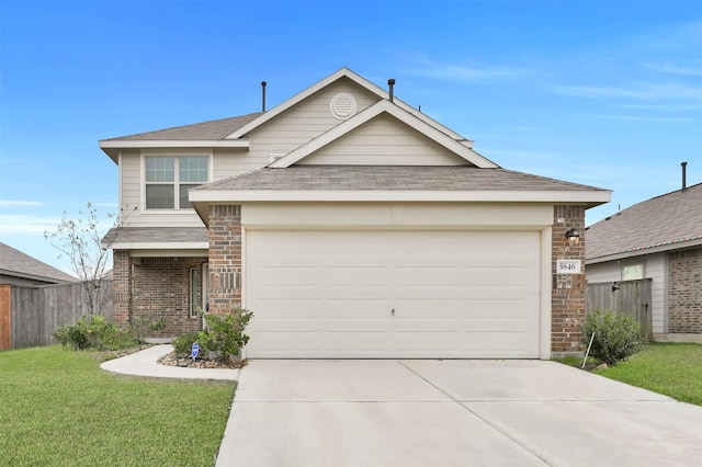 view of front facade featuring a garage and a front lawn