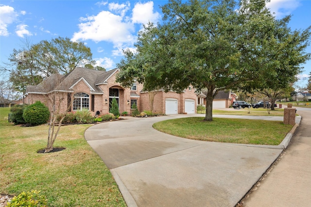 view of front of house with a front yard and a garage