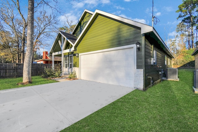 view of property exterior featuring a yard and a garage