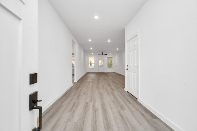 hall with light hardwood / wood-style floors