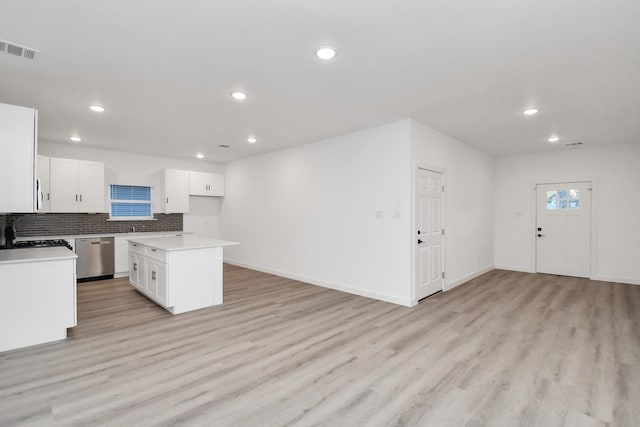 kitchen with dishwasher, light wood-type flooring, a center island, and white cabinetry