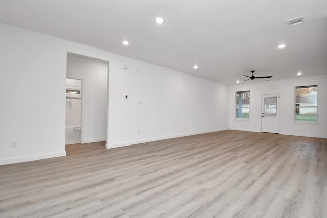 unfurnished living room featuring light hardwood / wood-style floors and ceiling fan