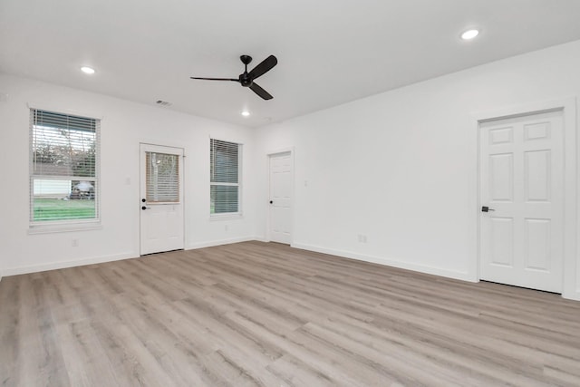 unfurnished room with ceiling fan and light hardwood / wood-style flooring