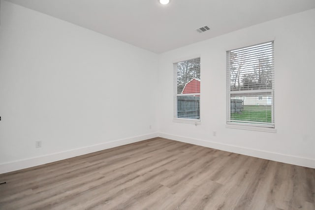 unfurnished room featuring light hardwood / wood-style floors