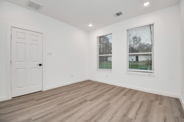 empty room with light wood-type flooring