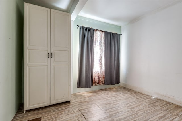 unfurnished bedroom with a closet