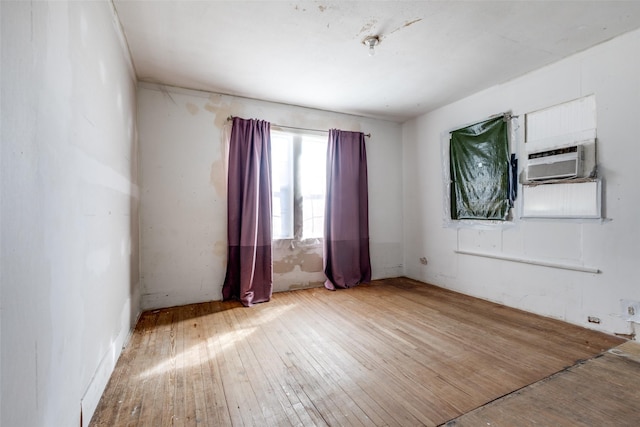 unfurnished room featuring hardwood / wood-style floors