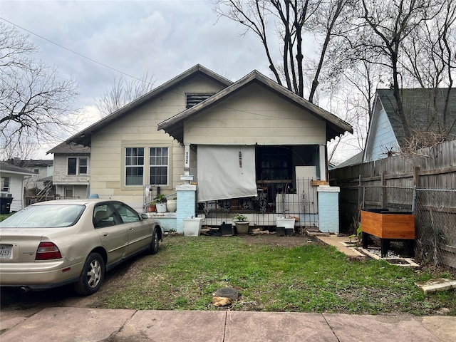 bungalow with a front yard