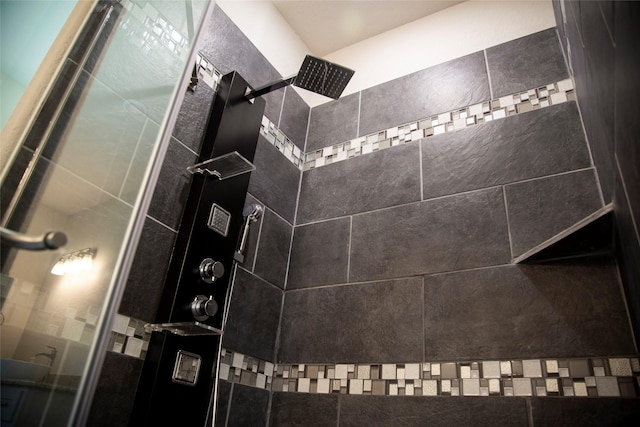 bathroom with tiled shower