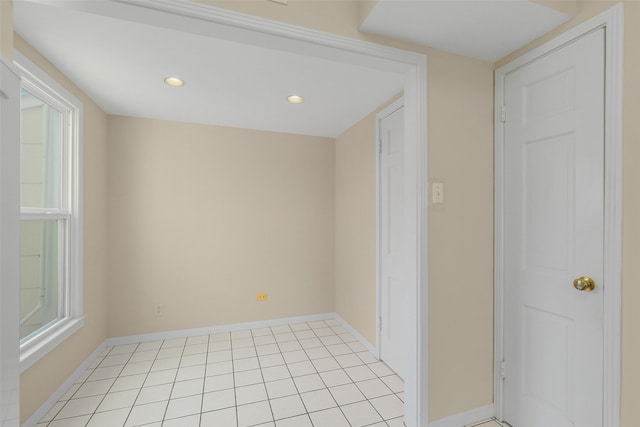 unfurnished room with light tile patterned floors