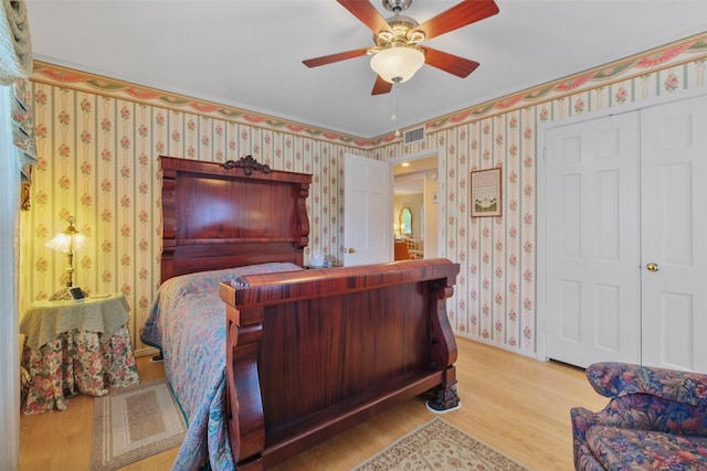 bedroom featuring wood-type flooring and ceiling fan