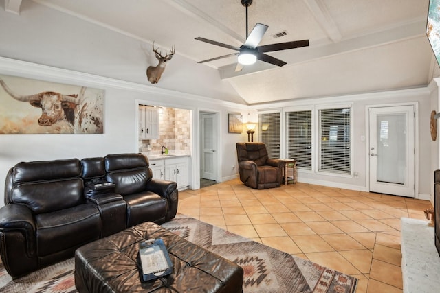 tiled living room featuring vaulted ceiling, ceiling fan, and sink