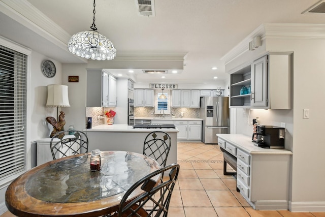 dining area featuring light tile patterned floors, ornamental molding, and sink