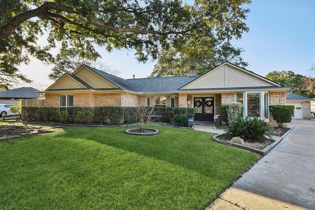 ranch-style house with a front yard and french doors