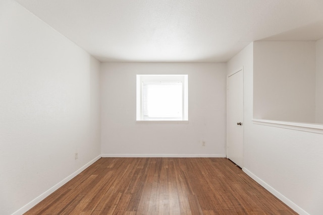 empty room featuring hardwood / wood-style flooring