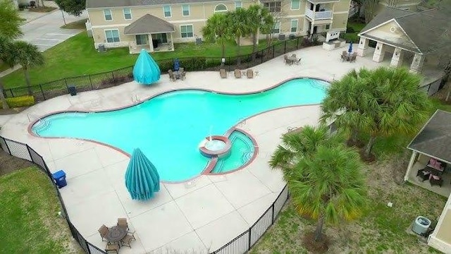 view of swimming pool with a patio area