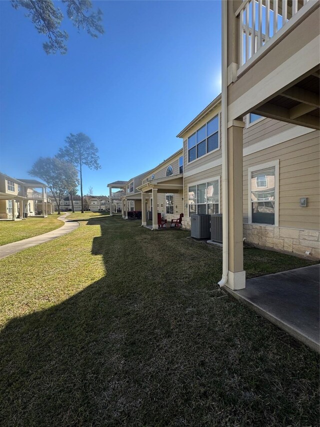 view of yard featuring central AC