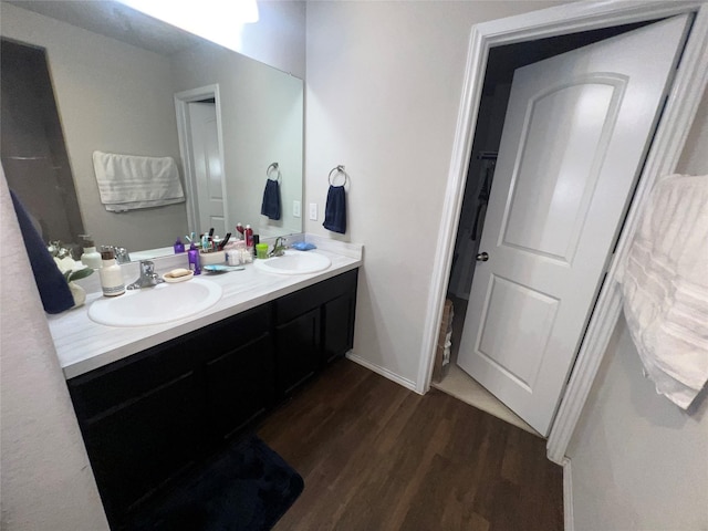 bathroom with wood-type flooring and vanity