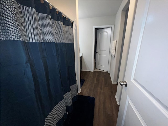 bathroom featuring a shower with shower curtain, vanity, and hardwood / wood-style flooring