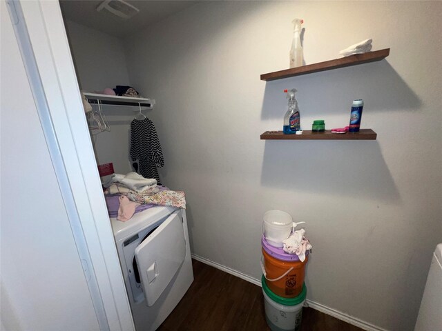 laundry room with separate washer and dryer and dark hardwood / wood-style floors