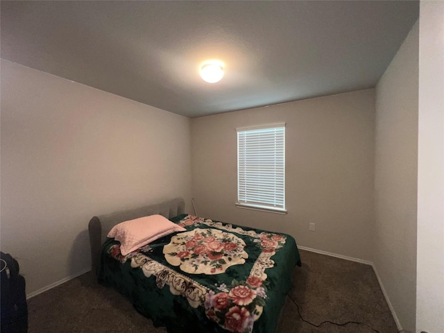 bedroom featuring dark carpet