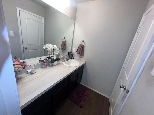 bathroom featuring vanity and wood-type flooring