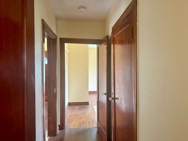 hallway featuring dark hardwood / wood-style floors