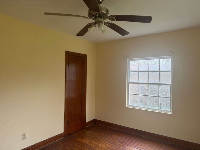 unfurnished room featuring dark wood-type flooring