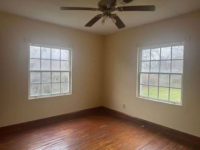 unfurnished room featuring hardwood / wood-style flooring