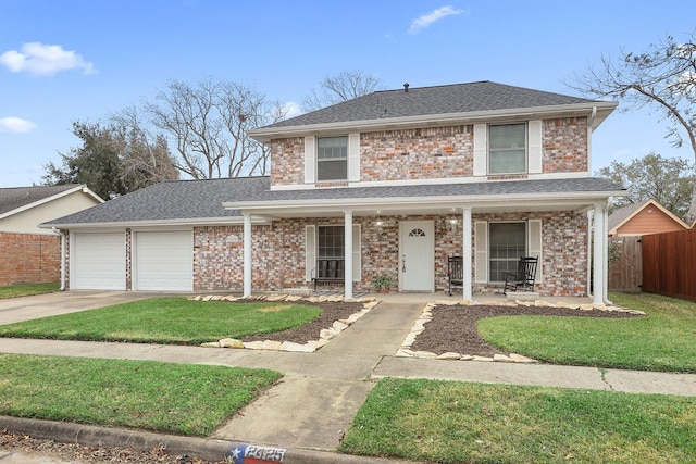 view of front property with covered porch and a garage