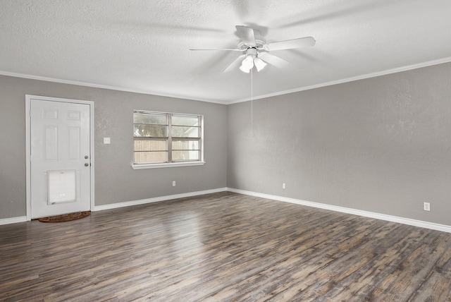 spare room featuring a textured ceiling, dark hardwood / wood-style flooring, ceiling fan, and ornamental molding