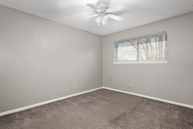 spare room with carpet, a textured ceiling, and ceiling fan