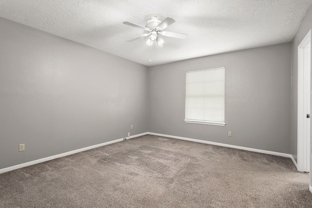 empty room featuring carpet flooring, a textured ceiling, and ceiling fan