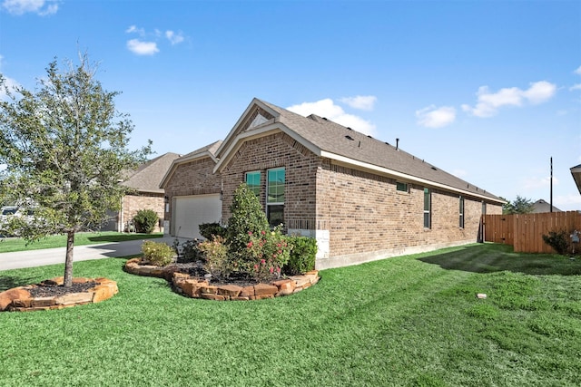 view of side of home featuring a lawn and a garage