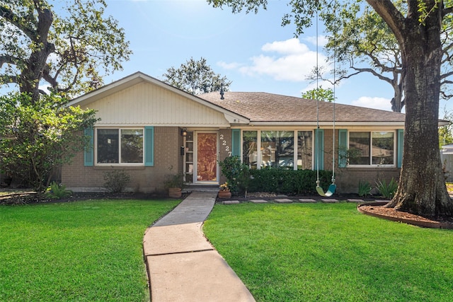 ranch-style house featuring a front lawn