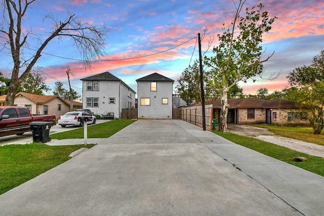 view of front of property with a lawn