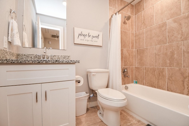 bathroom featuring toilet, vanity, baseboards, tile patterned floors, and shower / bath combination with curtain