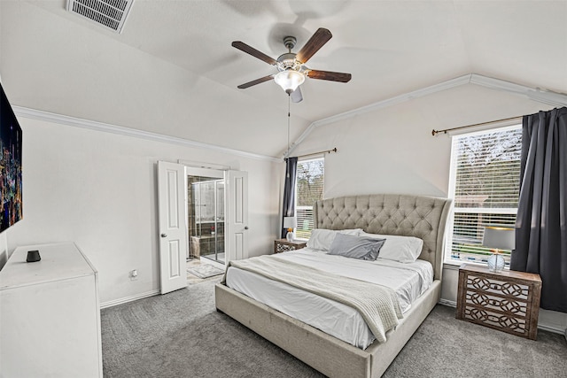 carpeted bedroom with lofted ceiling, ensuite bathroom, ceiling fan, and crown molding